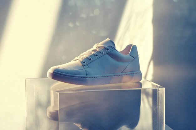 Photo stylish sneakers on display pedestals perfect for graphic designers