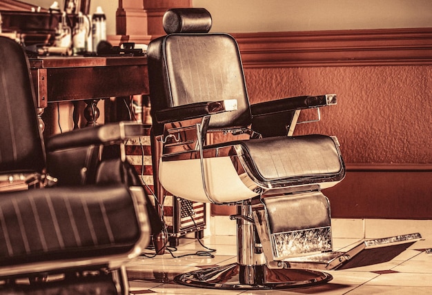 Stylish vintage barber chair Professional hairstylist in barbershop interior Barber shop chair Barbershop armchair modern hairdresser and hair salon barber shop for men