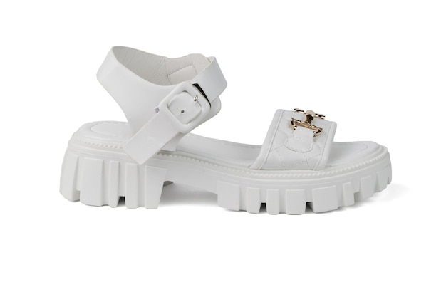 Stylish white leather women's sandal with right foot isolated on a white background