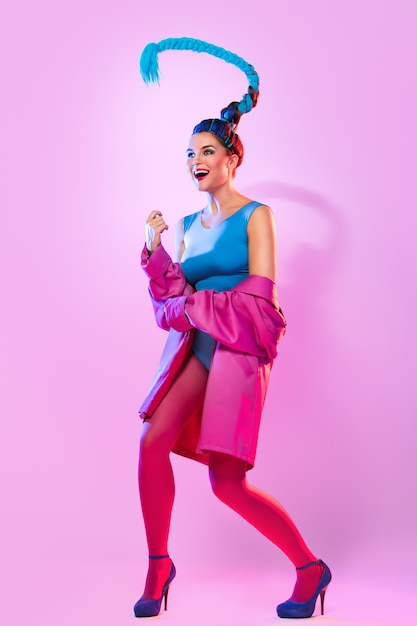 Stylish woman in pink and blue clothes