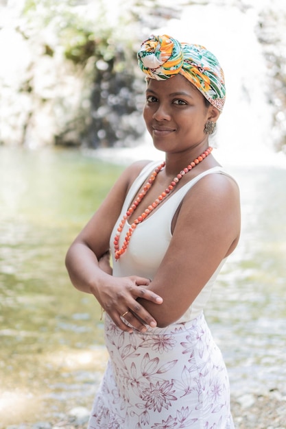 Stylish woman poses confidently wearing colorful headscarf