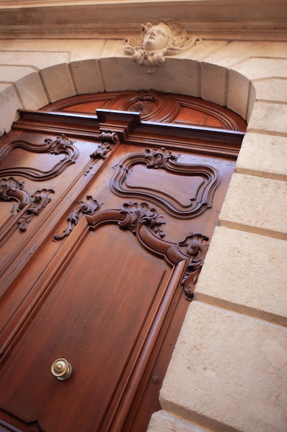 Stylish wooden door on a French mansion