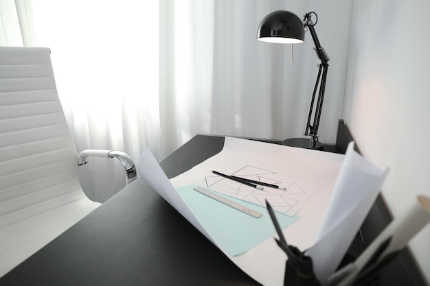 Photo stylish workplace with modern lamp and stationery