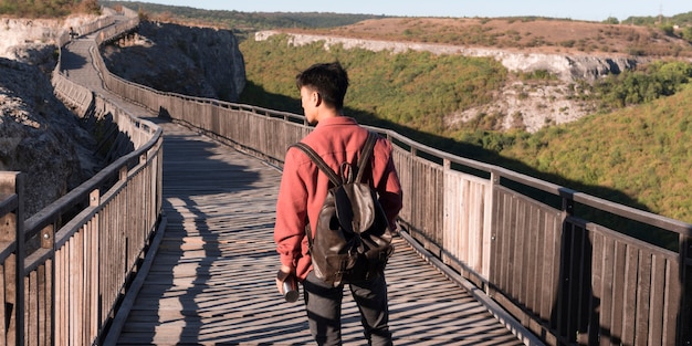 Stylish young man enjoying trip