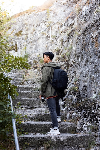 Stylish young man enjoying trip