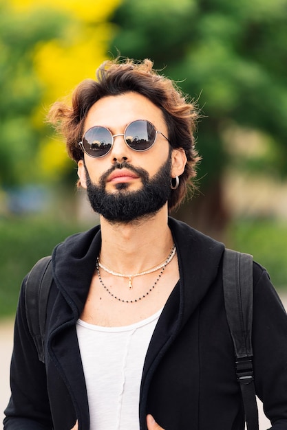 Stylish young man with beard and sunglasses