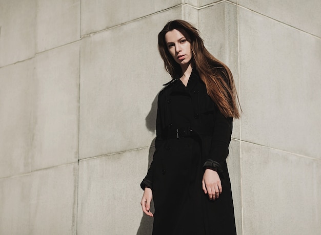 Stylish young woman in city