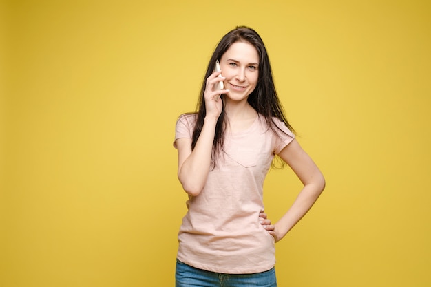 Stylish young woman talking by phone