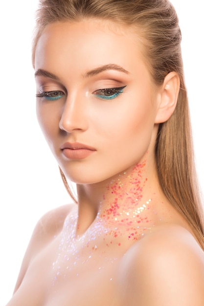 Stylish young woman with perfect makeup and glitter on her neck. Closeup shot