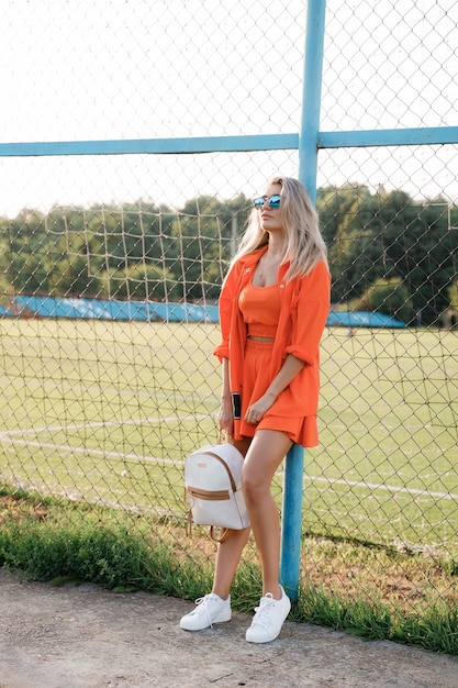 Stylishly dressed woman in sunglasses