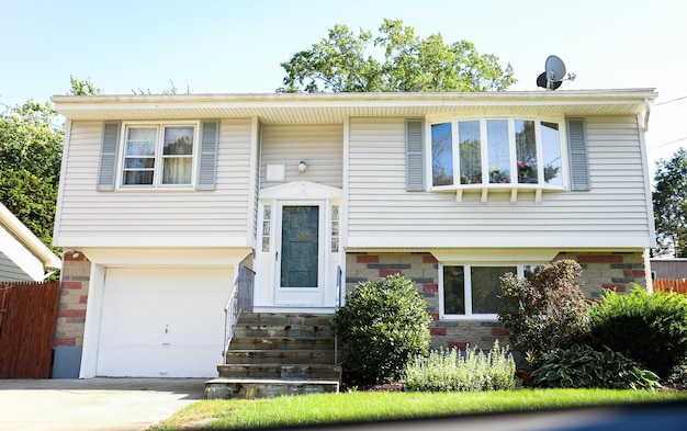 suburban house symbolizing the mortgage housing crisis rising prices and inflation in the housing