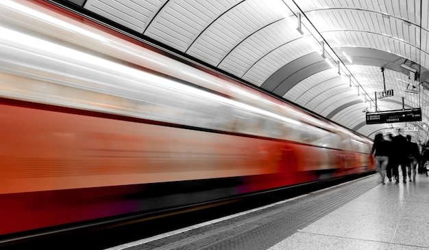 Subway train in motion arriving at a London underground train station