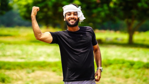 Succeed indian young farmer boy with his land in village