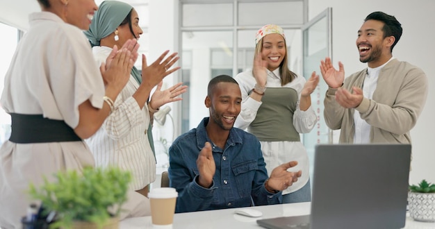 Success applause and black man with proposal in office at startup business with proud team Congratulations cheering and support for winner target achievement with employees clapping hands at desk