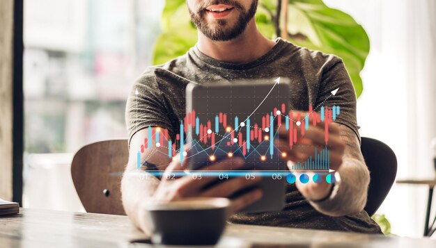 Success hipster man relaxing using digital smartphone looking at screen progress of business financial investment data graph and chart business growth increase at cafex9