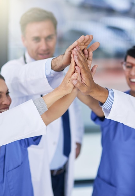 Success is best when achieved as a team Closeup shot of medical practitioners giving each other a high five