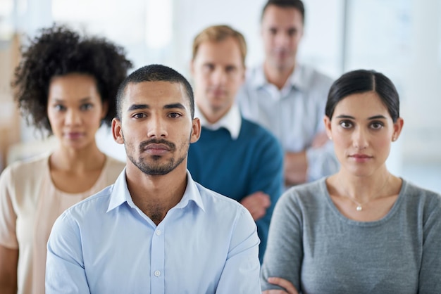 Success or nothing at all Portrait of a group of diverse colleagues standing in an office