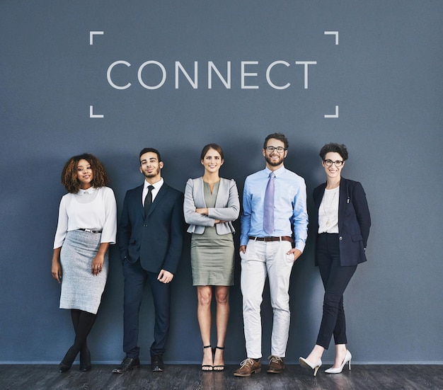 Success teamwork and united community pose of business workers standing together Modern global office team feeling confident and connected Group of diverse staff posing with copyspace background