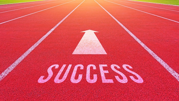 Success text written on an athletics track concept for business planning strategies and challenges or career path opportunities and change road to success concept