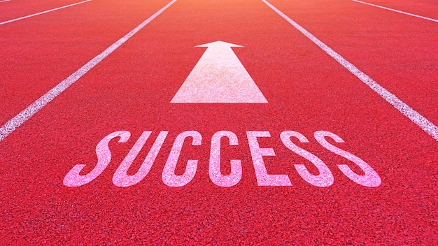 Photo success text written on an athletics track concept for business planning strategies and challenges or career path opportunities and change road to success concept