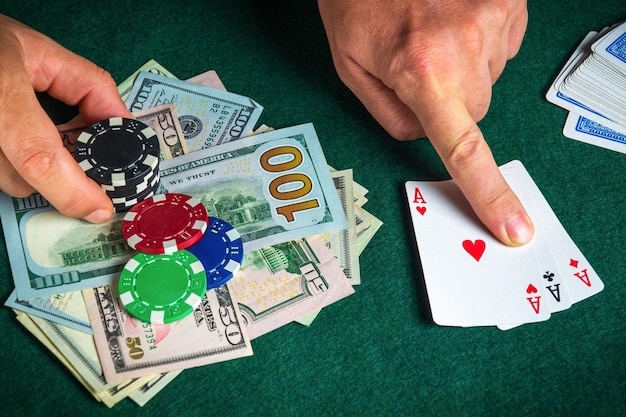 Success in winning on the table in a poker club with a combination of cards three aces