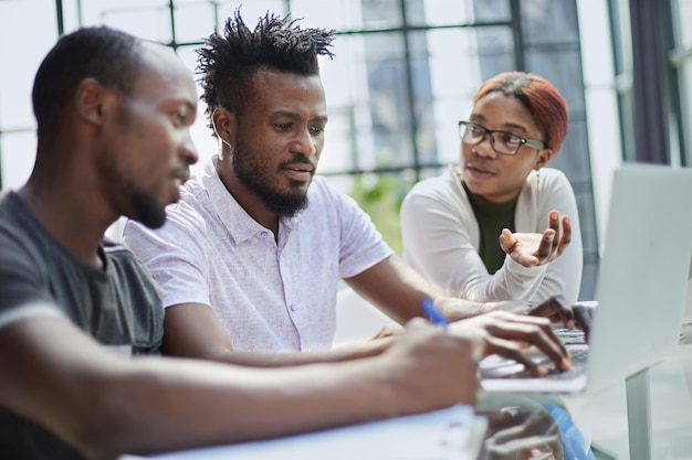 Successful african american business team talking about strategy at office