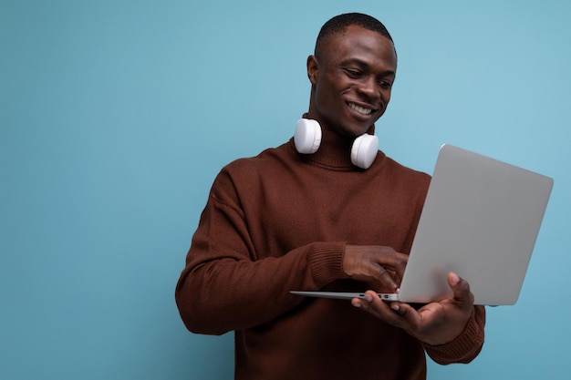 Successful african businessman demonstrating his projects using laptop