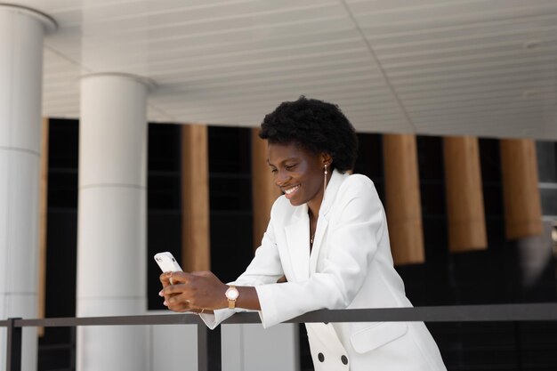 successful african businesswoman with mobile phone