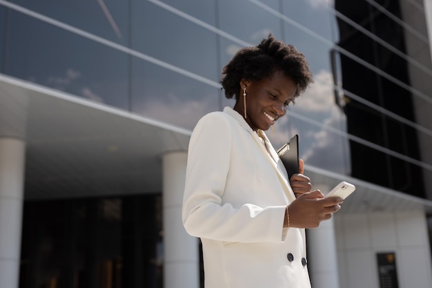 successful african businesswoman with mobile phone