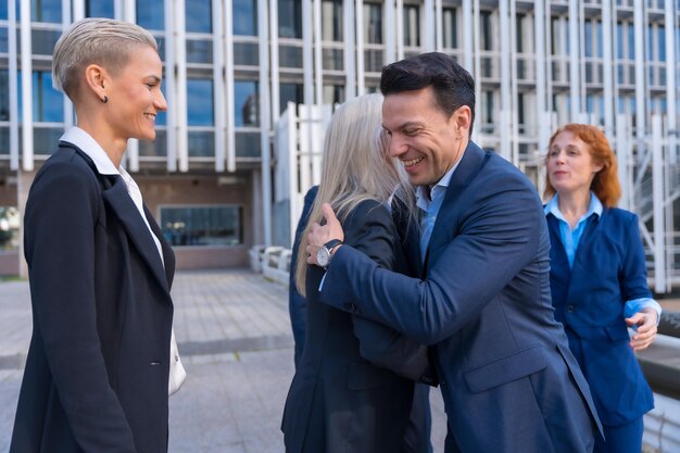 Photo successful business executives congratulating each other in corporate district