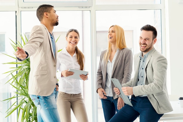 Successful business group.Group of smiling business people standing and communicating.