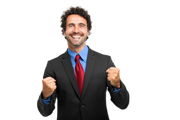 Successful business man with arms open - isolated over a white background