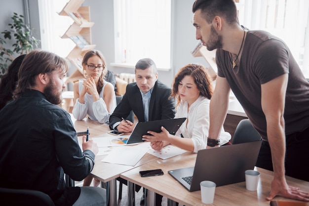 Successful business people are talking and smiling during in office.