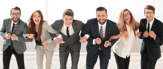 Successful business team standing together photo with copy space