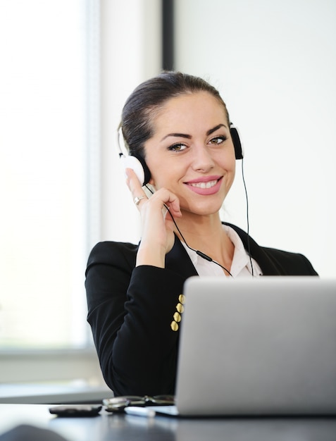 Successful business woman with headset