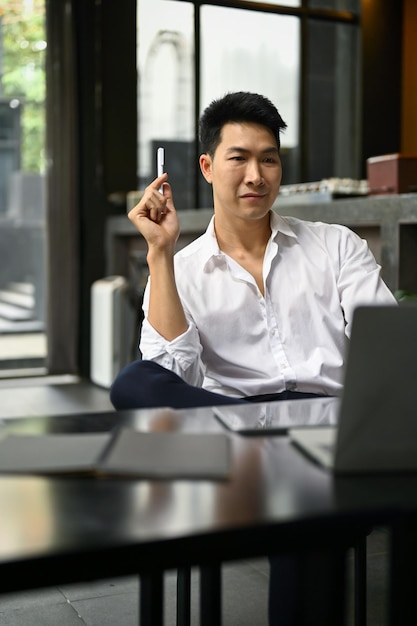 Successful businessman planning his project while sitting in a coffee shop