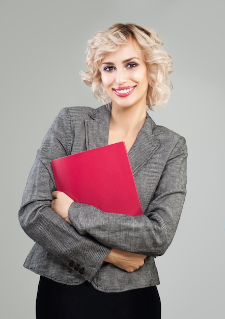 Successful businesswoman in suit holding red document case