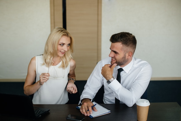 Successful employees in the office discuss new projects. Business, Finance