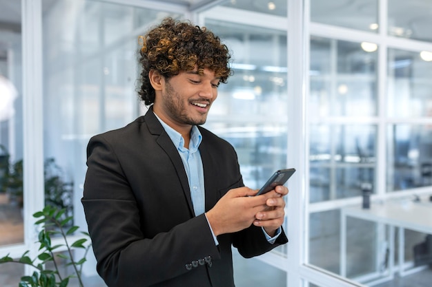 Successful financier investor works inside office at work businessman in business suit uses