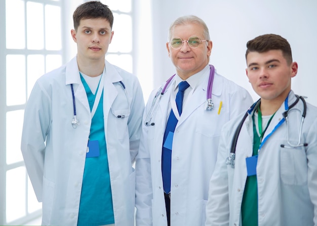 Successful medical team Confident doctors team standing together and smiling