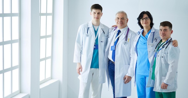 Successful medical team confident doctors team standing together and smiling