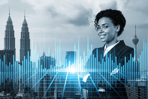 Successful smiling attractive black woman trader suggesting a new strategy of investment in stocks to grow client income Woman in business concept Forex chart Kuala Lumpur Double exposure