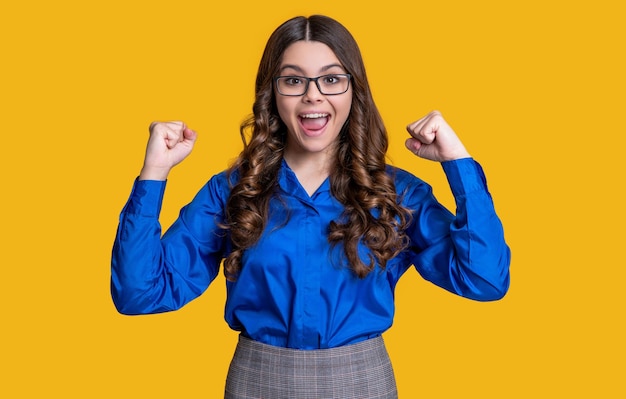 Successful teen girl look in eyewear isolated on yellow teen girl look in eyewear in studio