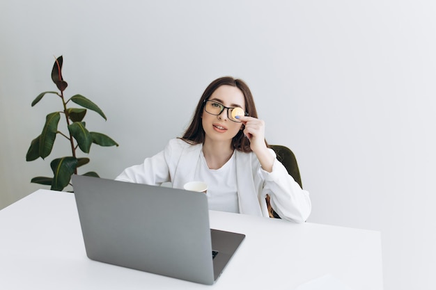 Successful woman holding gold bitcoin in her hand