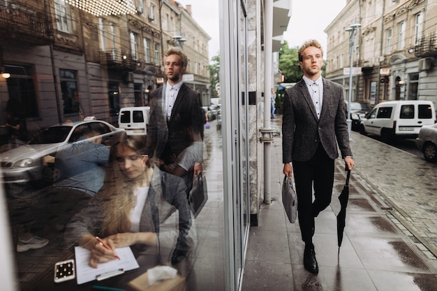 Successful young businessman and a businesswoman in a cafe