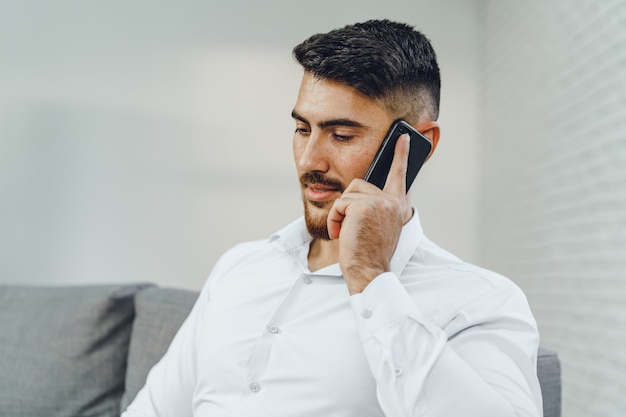 Successful young businessman talking on his cellphone