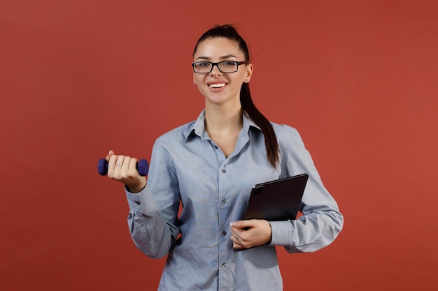 Successful young modern businesswoman warming up at office while working Business work woman and sport fitness workout exercise concept