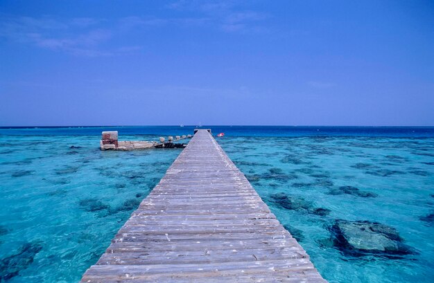 SUDAN Sanghaneb coral reef view of the reef and a wooden jetty