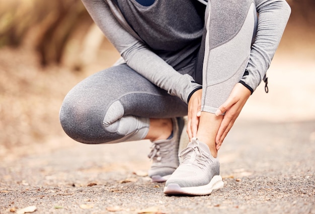 Suddenly the run wasnt so fun Shot of an unrecognisable woman experiencing ankle pain while working out in nature