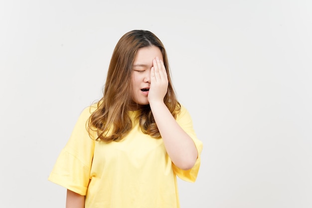 Suffering Headache of Beautiful Asian Woman wearing yellow TShirt Isolated On White Background